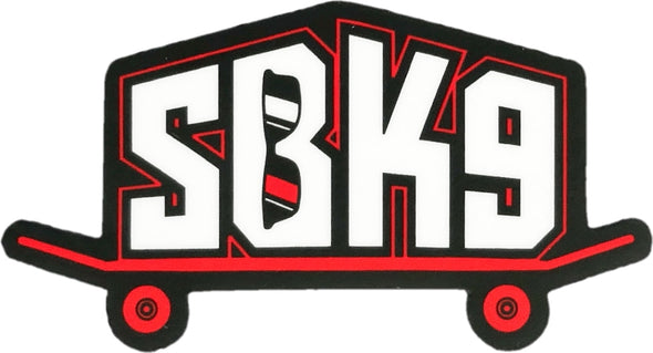 White SBK9 block letters outlined in red on red skateboard with the letter B containing sunglasses
